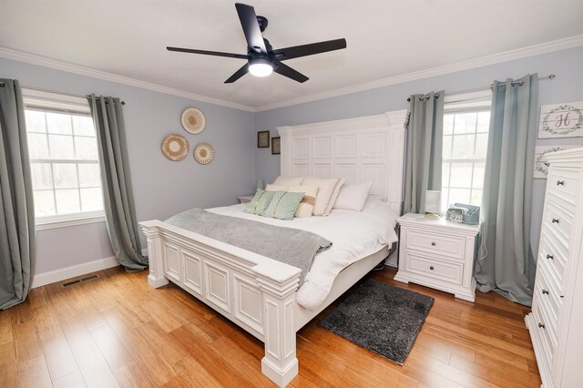 251 Pettigrew Rd, Milledgeville, GA 31061 - bedroom featuring crown molding, multiple windows, light wood finished floors, and visible vents