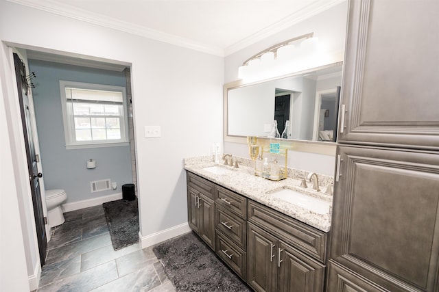 251 Pettigrew Rd, Milledgeville, GA 31061 - bathroom featuring visible vents, crown molding, toilet, and a sink