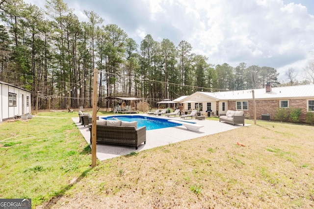 251 Pettigrew Rd, Milledgeville, GA 31061 - pool featuring central air condition unit, a patio, a diving board, an outdoor living space, and a yard