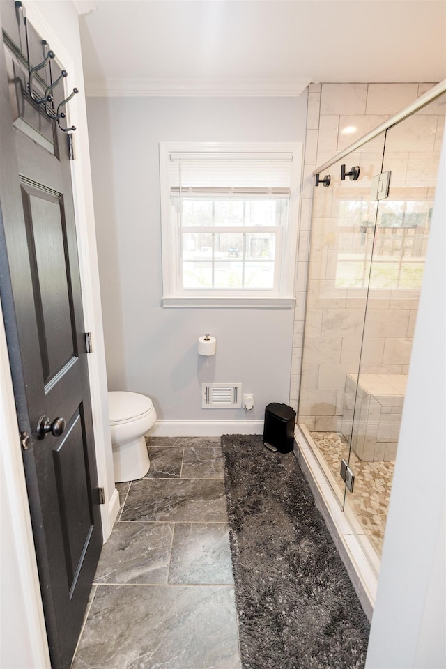 251 Pettigrew Rd, Milledgeville, GA 31061 - full bath featuring ornamental molding, visible vents, toilet, and a stall shower
