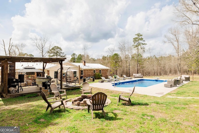 251 Pettigrew Rd, Milledgeville, GA 31061 - pool with a deck, a fire pit, a diving board, a yard, and a patio area