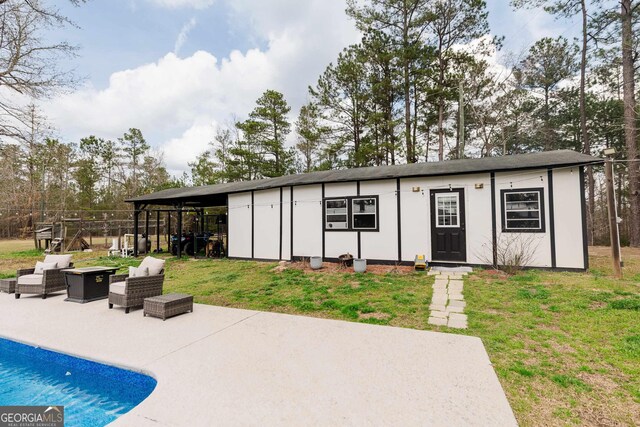 251 Pettigrew Rd, Milledgeville, GA 31061 - exterior space with an outdoor structure, a fenced in pool, and outdoor lounge area