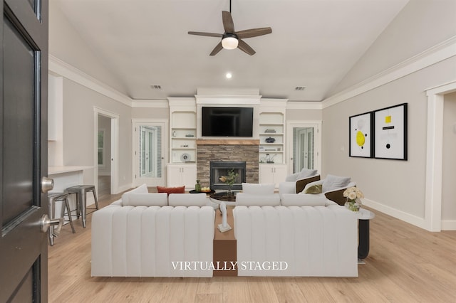 1101 Maple Ridge Way, Greensboro, GA 30642 - living room featuring light wood-style floors, a stone fireplace, a ceiling fan, baseboards, and lofted ceiling