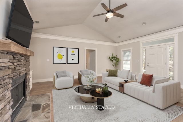 1101 Maple Ridge Way, Greensboro, GA 30642 - living area featuring ceiling fan, a fireplace, baseboards, wood finished floors, and lofted ceiling