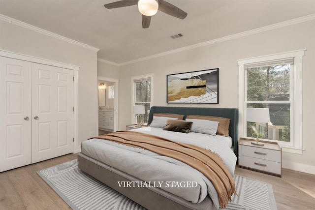 1101 Maple Ridge Way, Greensboro, GA 30642 - bedroom featuring multiple windows, visible vents, ornamental molding, and light wood finished floors
