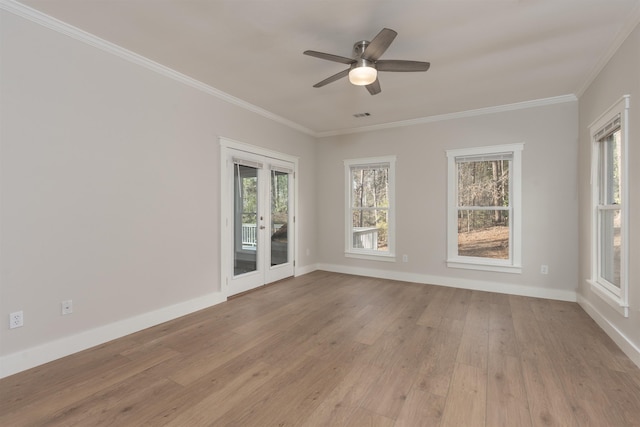 1101 Maple Ridge Way, Greensboro, GA 30642 - unfurnished room with crown molding, visible vents, baseboards, ceiling fan, and light wood-type flooring