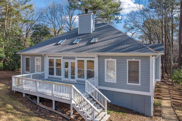 rear view of house with a wooden deck