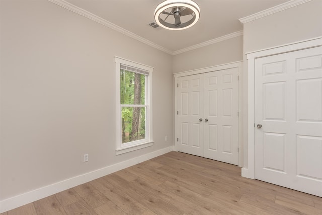 1101 Maple Ridge Way, Greensboro, GA 30642 - unfurnished bedroom featuring baseboards, visible vents, ornamental molding, and light wood finished floors