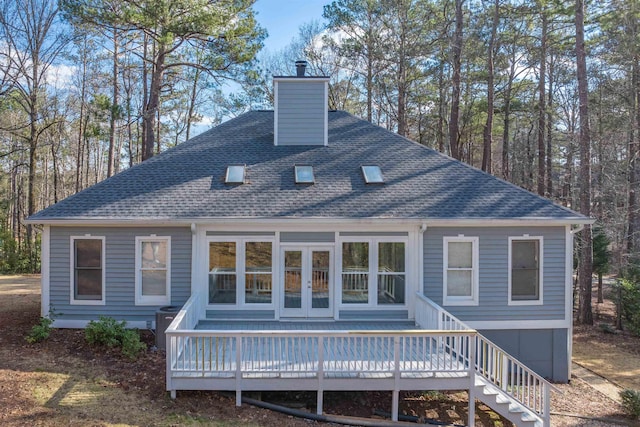 1101 Maple Ridge Way, Greensboro, GA 30642 - rear view of property featuring a wooden deck, a shingled roof, and a chimney