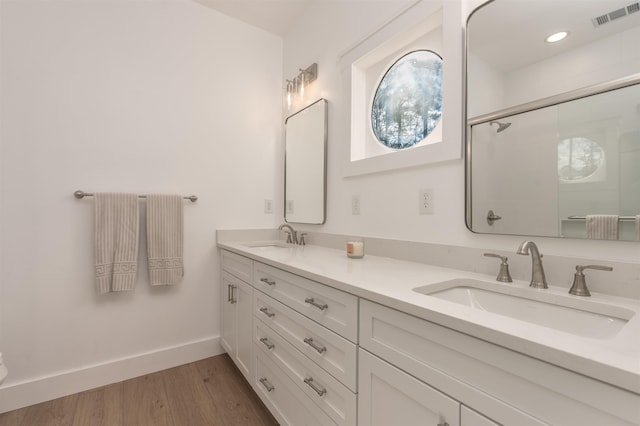 1101 Maple Ridge Way, Greensboro, GA 30642 - bathroom with an enclosed shower, baseboards, visible vents, and a sink