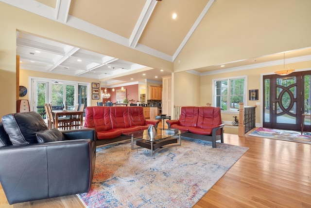 living room with crown molding, high vaulted ceiling, coffered ceiling, light hardwood / wood-style floors, and beamed ceiling