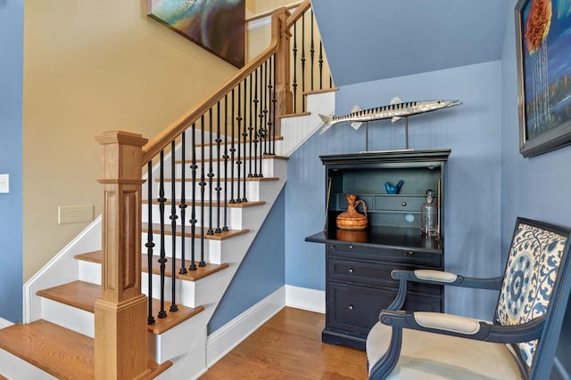 stairs with wood-type flooring