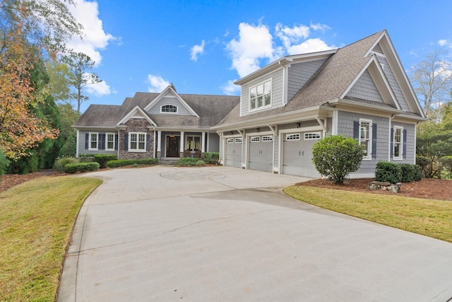 view of front of property featuring a garage and a front yard