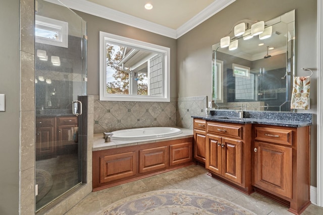 bathroom featuring crown molding, vanity, and shower with separate bathtub