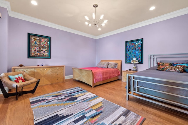 bedroom with an inviting chandelier, ornamental molding, and light wood-type flooring