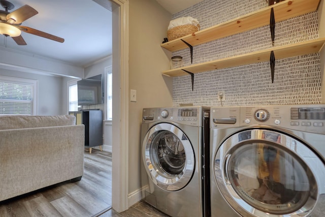 222 River Bend Dr, Eatonton, GA 31024 - laundry room with crown molding, a ceiling fan, washer and dryer, wood finished floors, and plenty of natural light