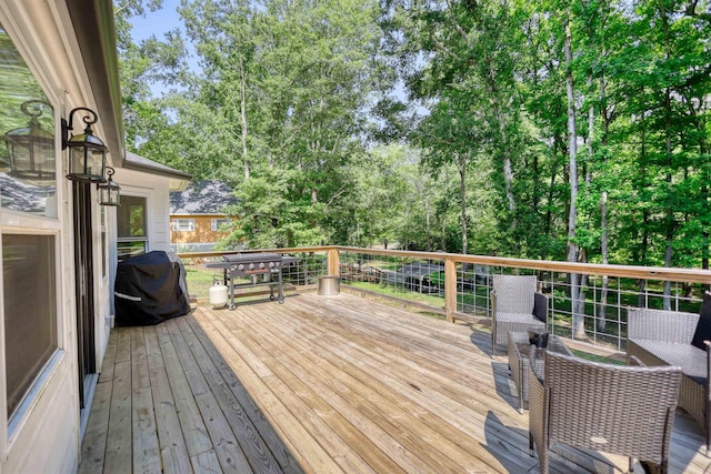 222 River Bend Dr, Eatonton, GA 31024 - wooden deck featuring a grill and view of scattered trees