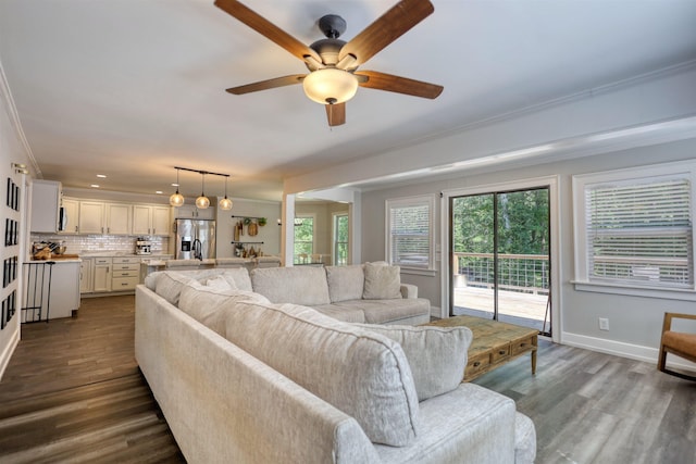 222 River Bend Dr, Eatonton, GA 31024 - living room featuring ceiling fan, dark wood-type flooring, plenty of natural light, ornamental molding, and recessed lighting