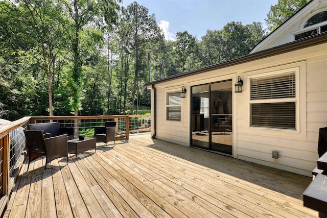 222 River Bend Dr, Eatonton, GA 31024 - deck with view of wooded area and an outdoor living space