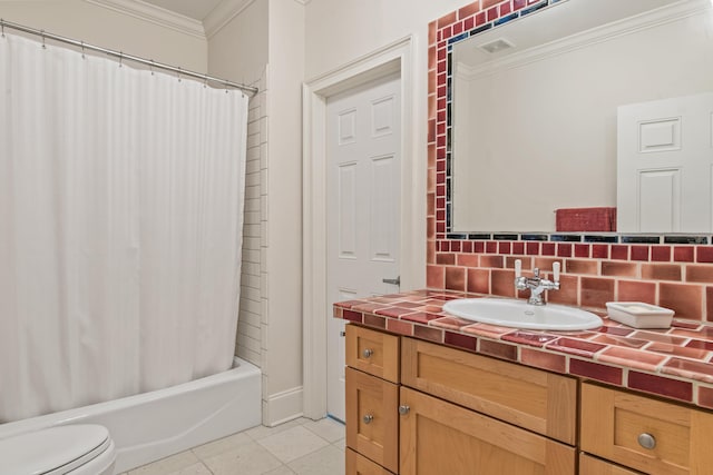 bathroom featuring crown molding, tile patterned flooring, vanity, toilet, and backsplash
