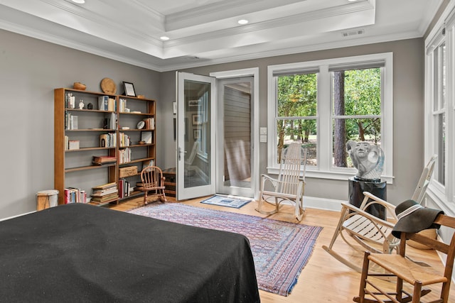 bedroom with ornamental molding, wood finished floors, access to outside, recessed lighting, and a raised ceiling