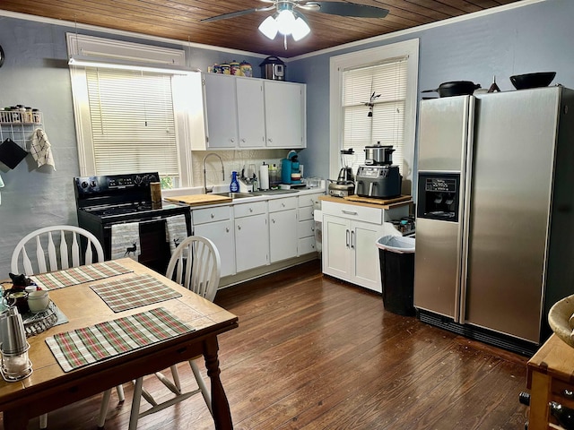 kitchen with stainless steel refrigerator with ice dispenser, sink, dark hardwood / wood-style flooring, black range with electric cooktop, and white cabinets