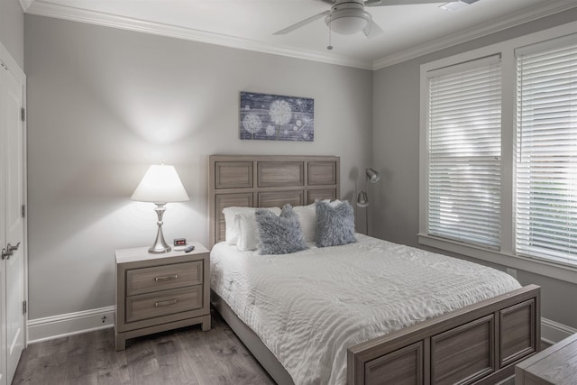 bedroom featuring crown molding, wood-type flooring, and ceiling fan