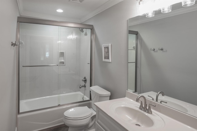 full bathroom with vanity, crown molding, toilet, and combined bath / shower with glass door