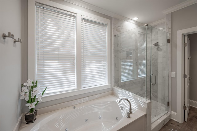 bathroom featuring crown molding and shower with separate bathtub