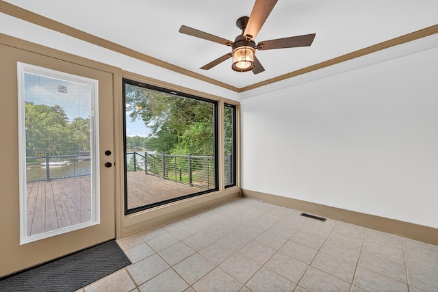 128 Turtle Ct, Eatonton, GA 31024 - empty room featuring a ceiling fan, crown molding, and light tile patterned flooring