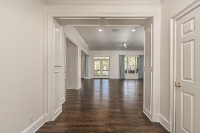 corridor with french doors, ornamental molding, and dark hardwood / wood-style flooring