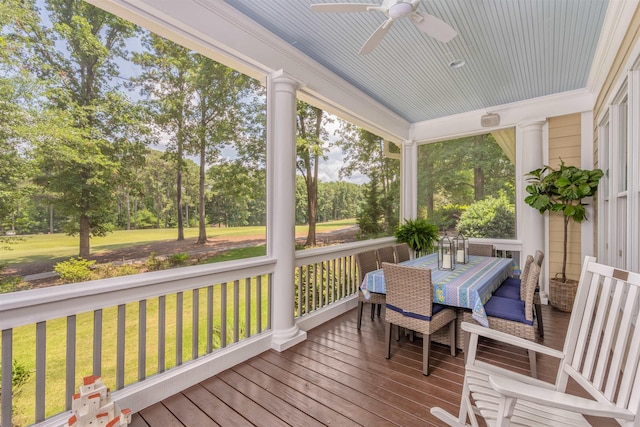 sunroom / solarium featuring ceiling fan