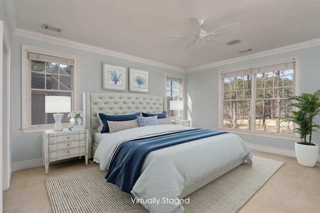 carpeted bedroom with crown molding, ceiling fan, and multiple windows