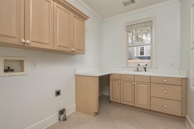 clothes washing area with sink, crown molding, light tile patterned floors, electric dryer hookup, and cabinets