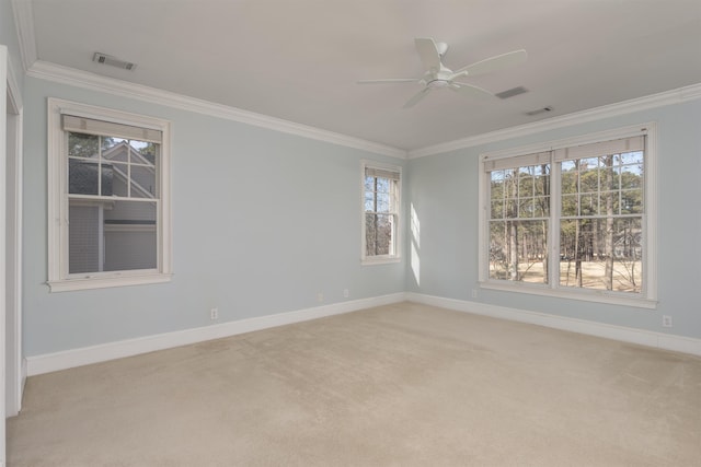 unfurnished room with light carpet, ornamental molding, and ceiling fan