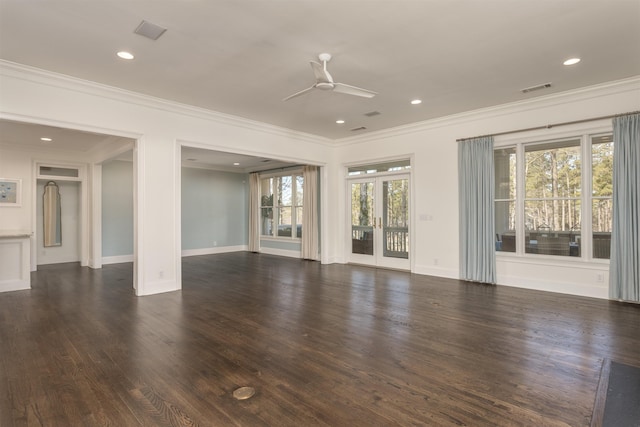 empty room featuring dark hardwood / wood-style flooring, ornamental molding, and ceiling fan