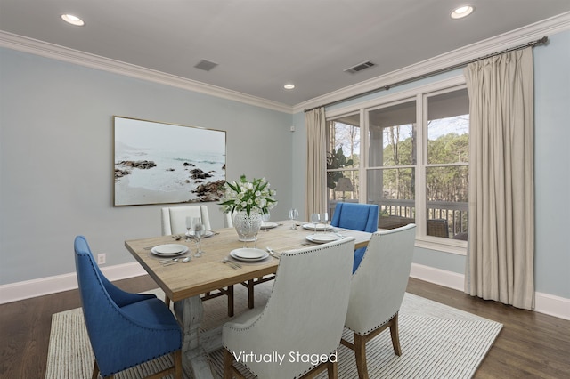 dining room featuring ornamental molding and dark hardwood / wood-style flooring