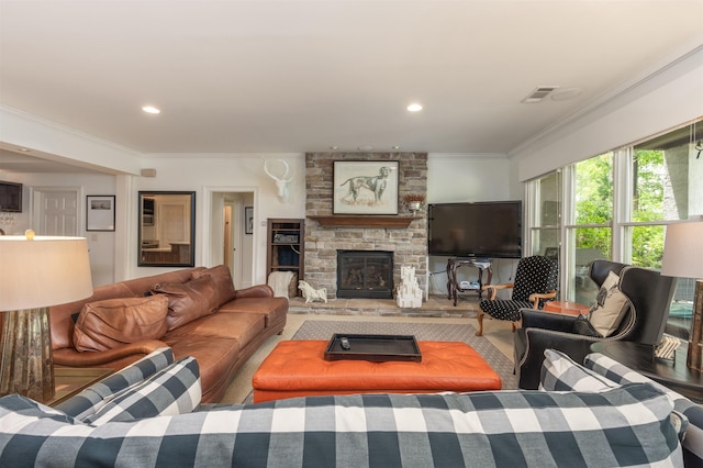 living room with a fireplace and ornamental molding