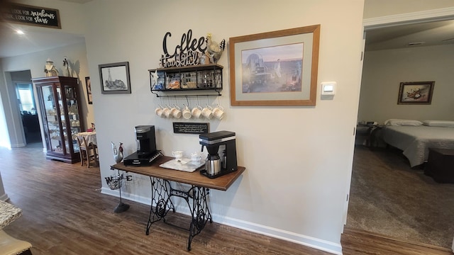  - hall featuring wood finished floors and baseboards