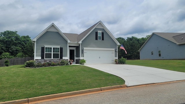 - view of front of house with concrete driveway, a garage, and stone siding