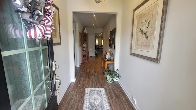  - entrance foyer with dark wood finished floors and baseboards