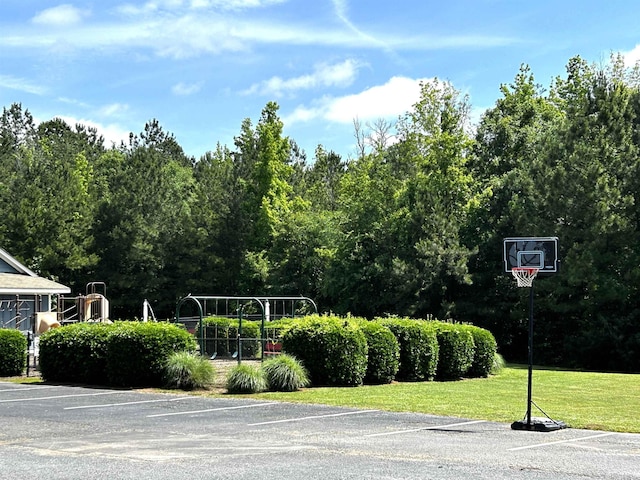  - view of sport court with a lawn