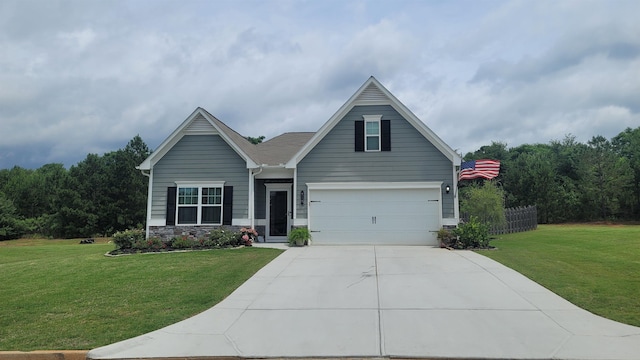  - view of front of home featuring driveway, an attached garage, and stone siding