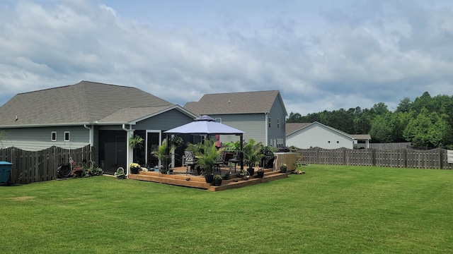  - rear view of house with a gazebo, a deck, a sunroom, and roof with shingles