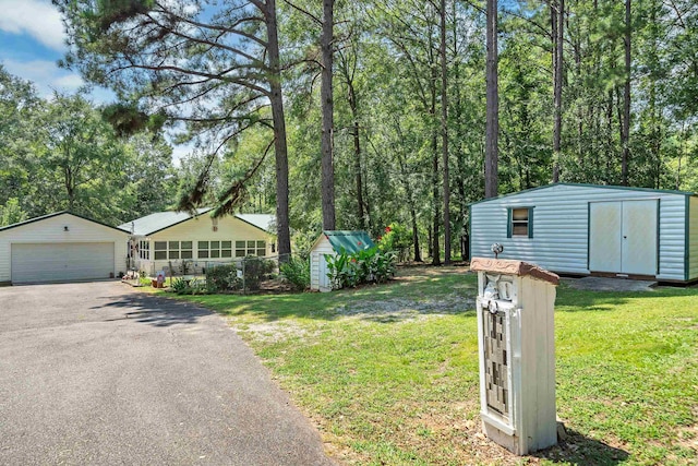 exterior space with a garage and a shed