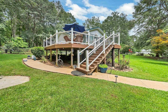 view of playground with a yard and a deck