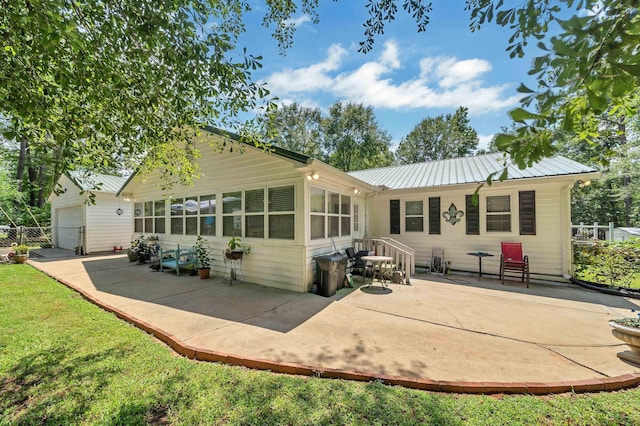 rear view of property featuring a patio