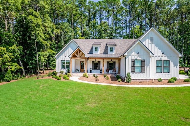 modern farmhouse style home featuring a porch and a front yard