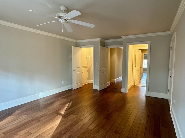 unfurnished bedroom with crown molding, baseboards, and dark wood-style flooring