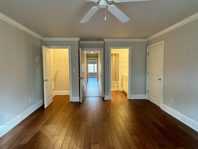 unfurnished bedroom featuring ceiling fan, baseboards, dark wood-style floors, and ornamental molding